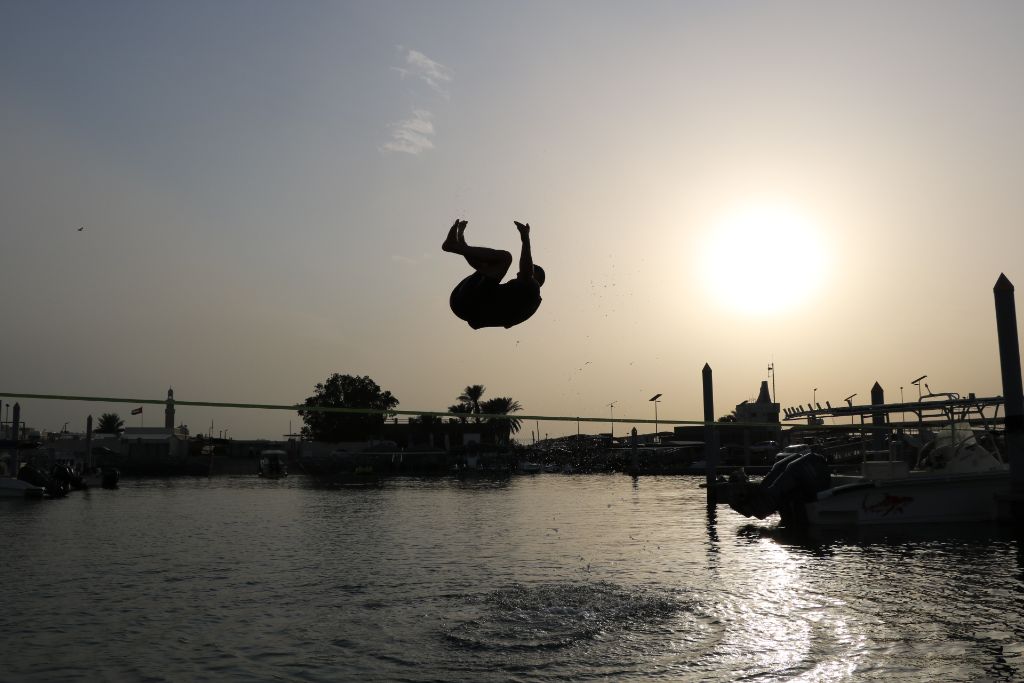 Spectacular backflip silhouette over Jumeirah waters