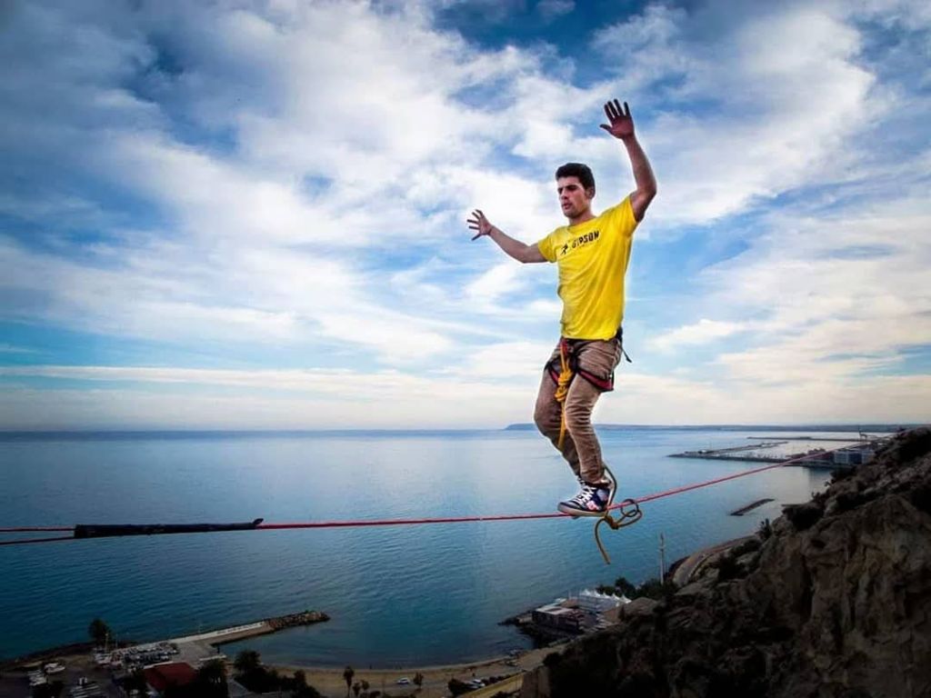 Highline slackline over coastal view